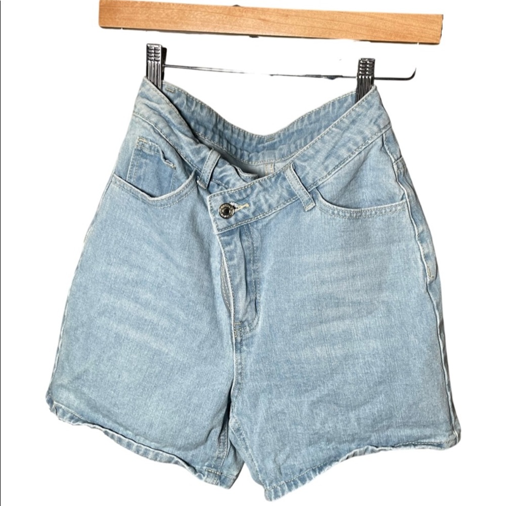 Light blue shorts. 2 buttons
